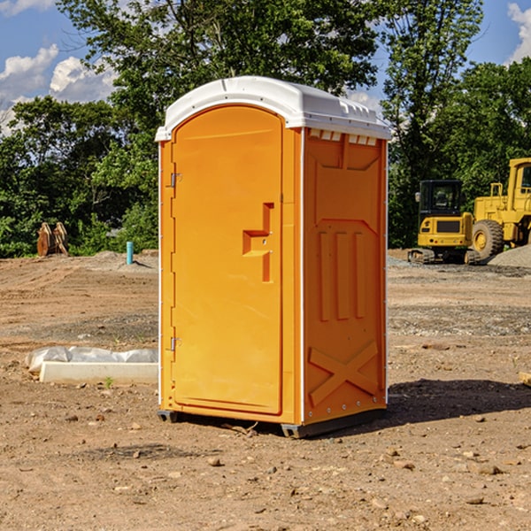 what is the cost difference between standard and deluxe porta potty rentals in Winchester Bay